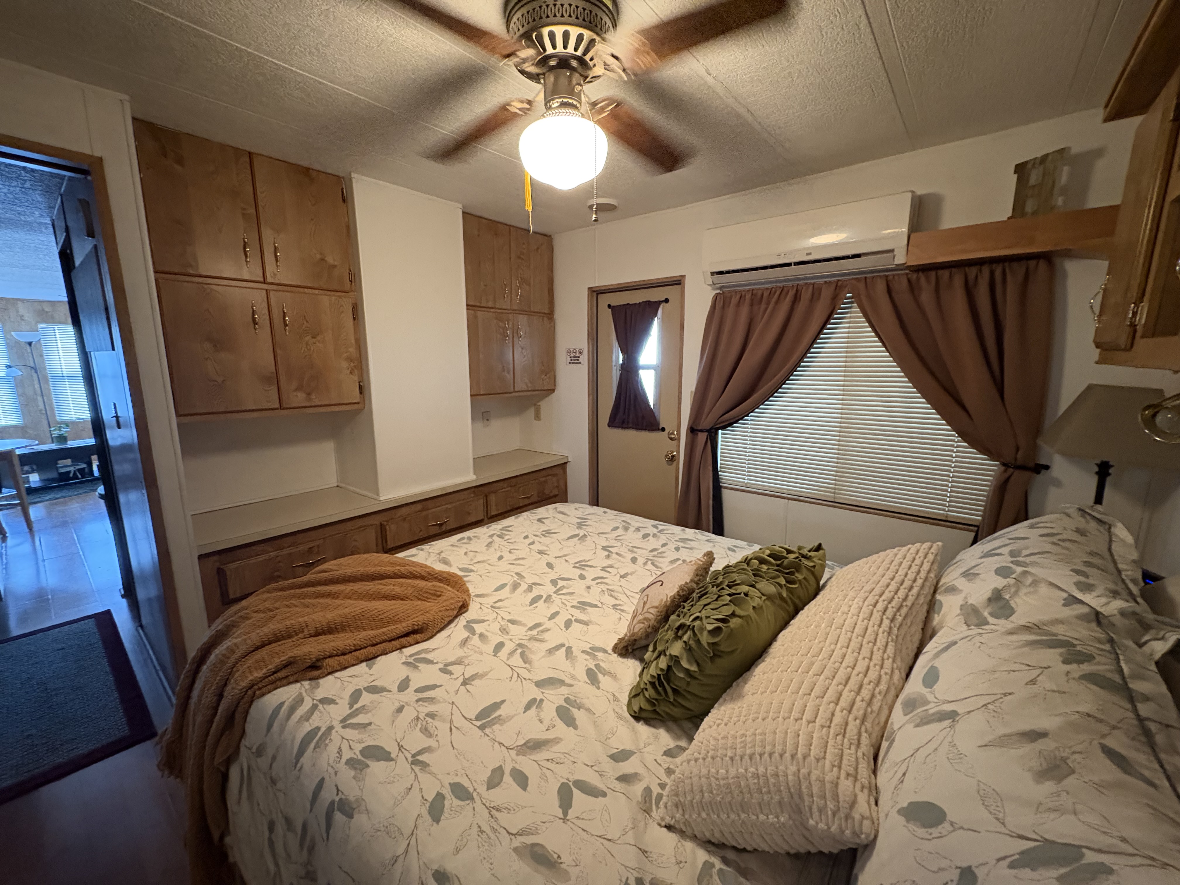 Queen bedroom with natural light